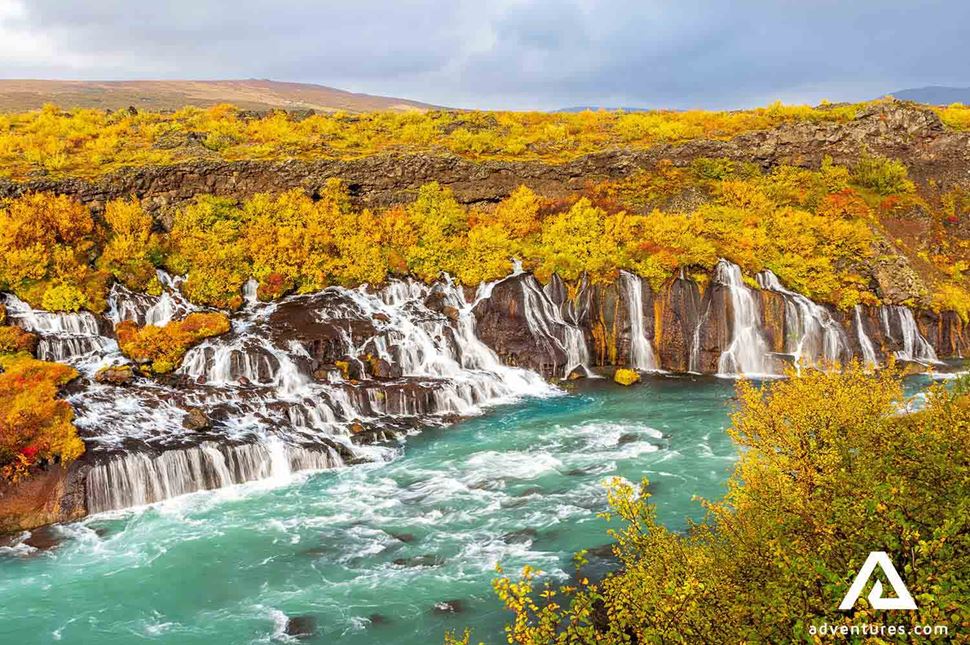 bright colour waterfall in autumn bright colour hraunfossar waterfall in autumn