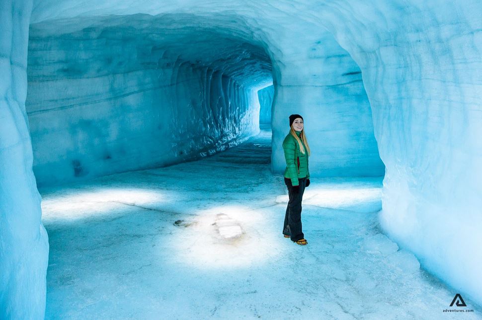 Woman inside Langjokull ice cave in Iceland Woman inside Langjokull ice cave