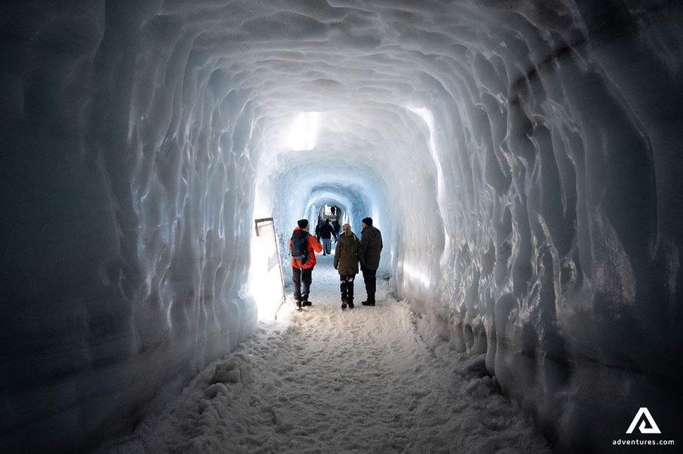 People Exploring Ice Tunnel People Exploring Ice Tunnel in Iceland