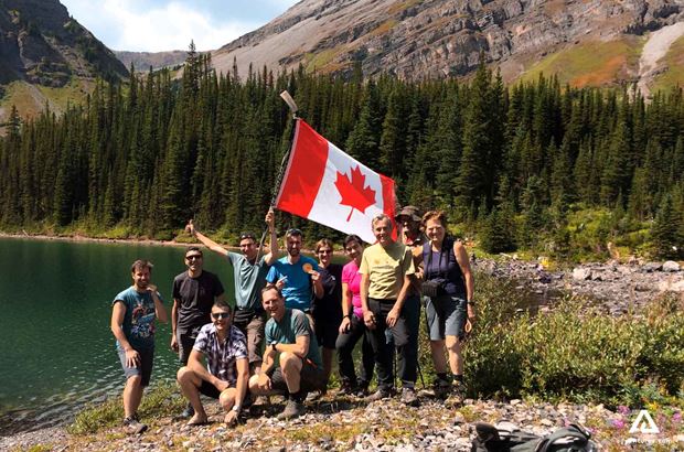 group of hikers with Canadian flag group of hikers with Canadian flag in yoho
